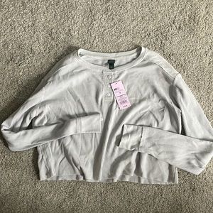 cropped long sleeve half button top